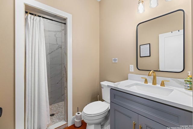 bathroom with vanity, a shower with curtain, and toilet