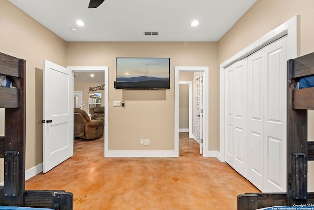 interior space with ceiling fan