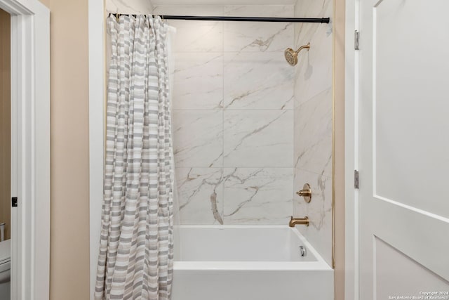 bathroom with shower / bath combination with curtain