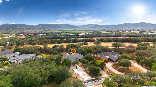 drone / aerial view featuring a mountain view