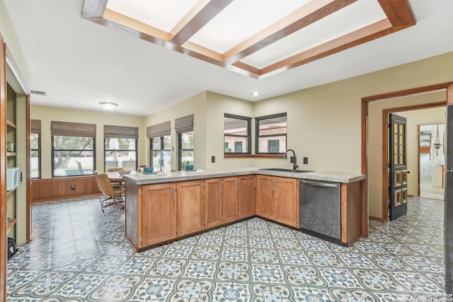 kitchen with dishwasher, sink, and kitchen peninsula