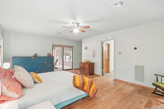 bedroom featuring access to exterior, light hardwood / wood-style flooring, and ceiling fan