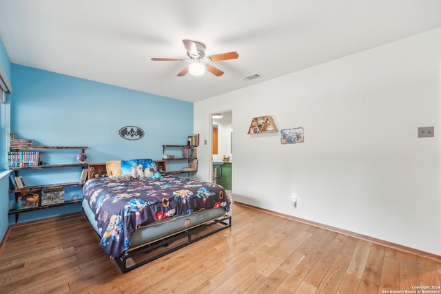 bedroom with hardwood / wood-style flooring and ceiling fan