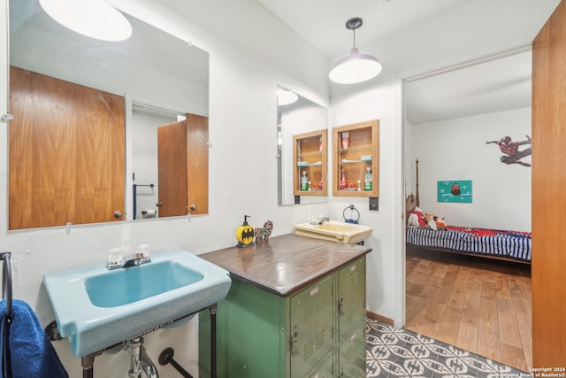 bathroom with sink and hardwood / wood-style floors