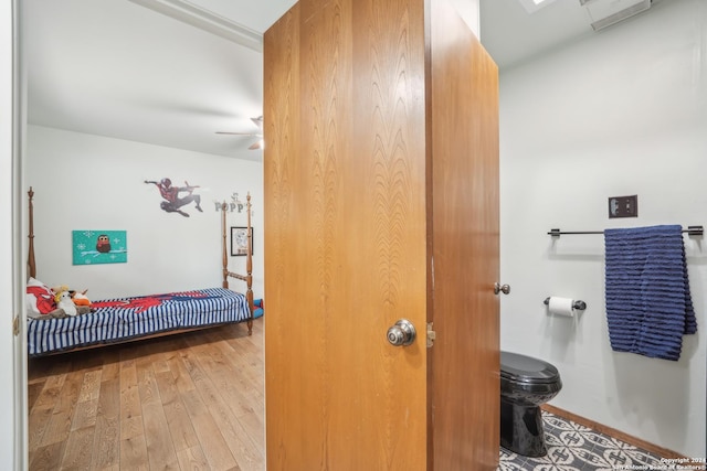 bathroom featuring wood-type flooring and ceiling fan