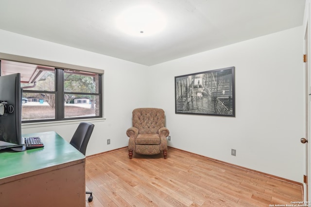 unfurnished office featuring light wood-type flooring