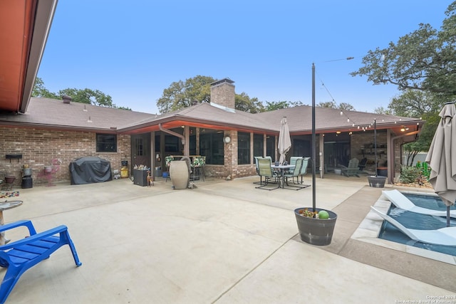 back of house featuring a patio area