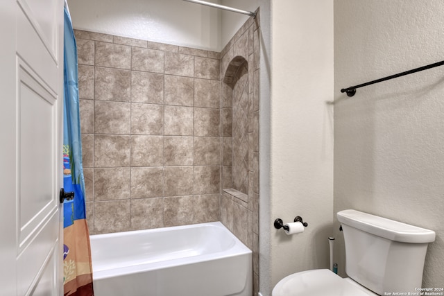 bathroom with toilet and shower / bathtub combination with curtain