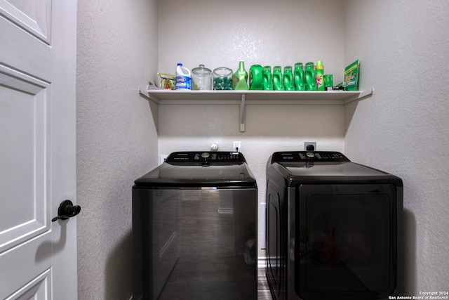 clothes washing area with separate washer and dryer