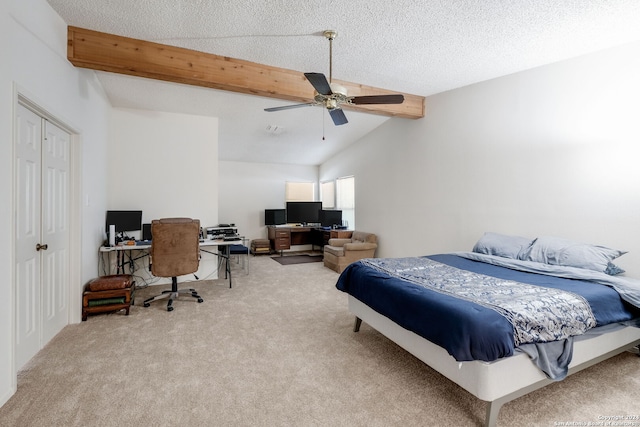 bedroom with a textured ceiling, ceiling fan, and carpet floors