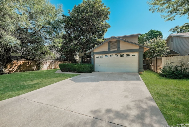 view of front facade featuring a front lawn and a garage