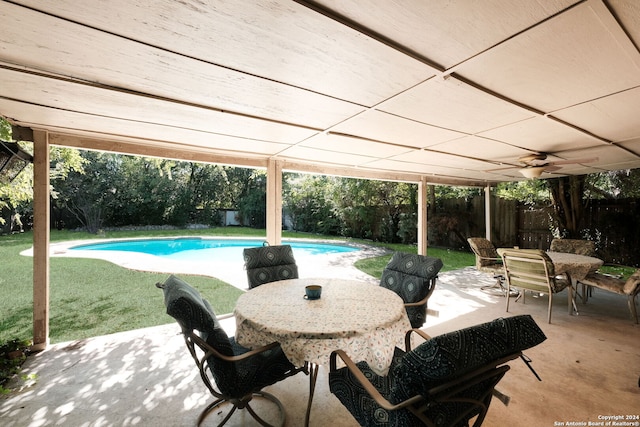 view of swimming pool featuring a lawn and a patio area