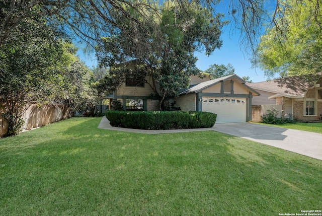 view of front facade with a garage and a front lawn