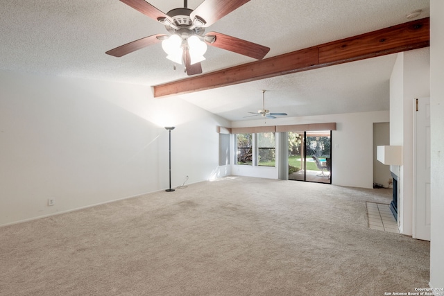 unfurnished living room with ceiling fan, lofted ceiling with beams, light carpet, and a textured ceiling