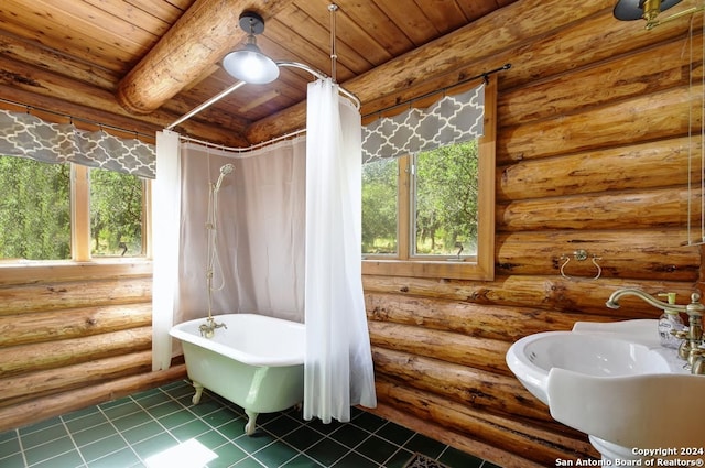 full bath featuring a sink, a freestanding tub, wood ceiling, and tile patterned flooring