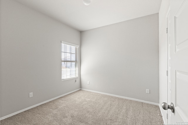 unfurnished room with carpet floors