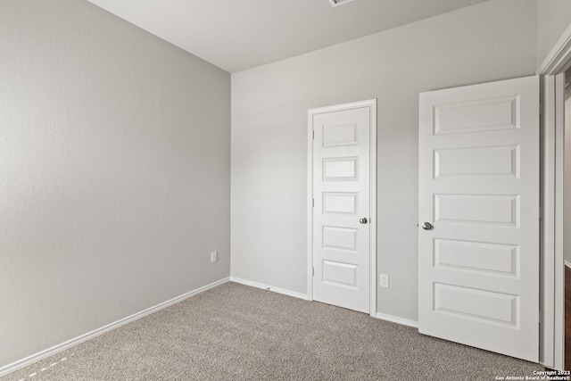 unfurnished bedroom with carpet floors