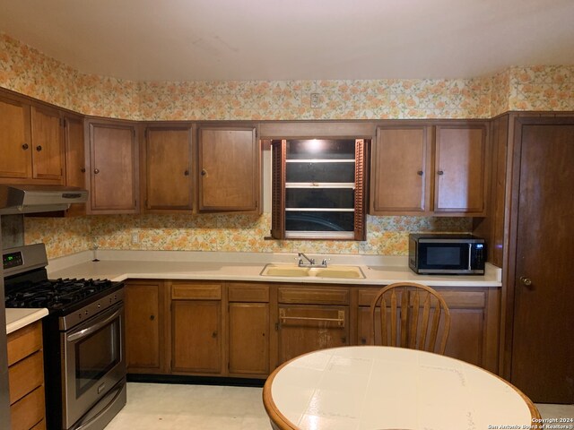 kitchen with appliances with stainless steel finishes and sink