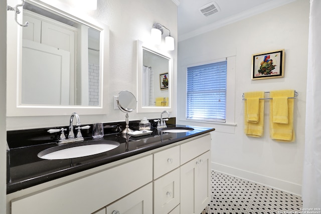 bathroom with vanity and ornamental molding