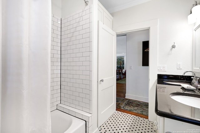 bathroom featuring ornamental molding, shower / tub combo with curtain, and vanity