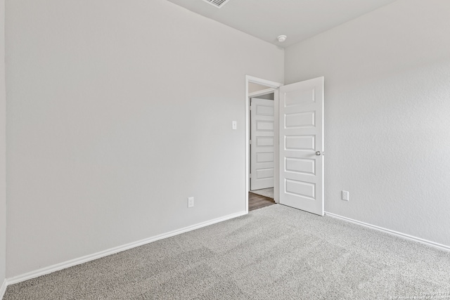 spare room with carpet flooring