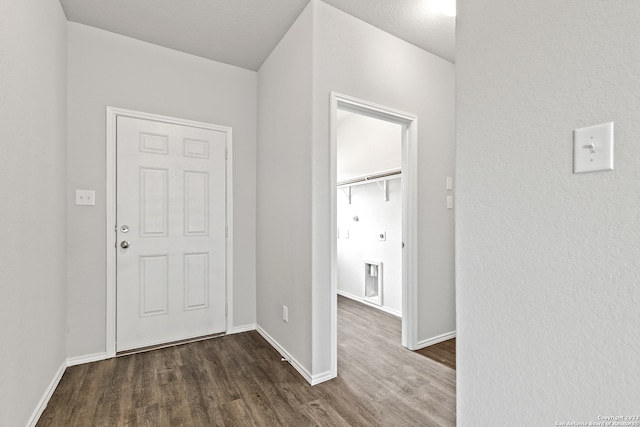 entryway with dark wood-type flooring