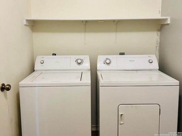 washroom featuring washer and dryer and laundry area