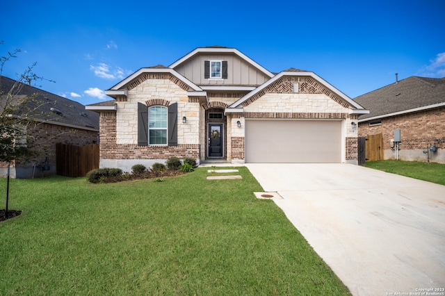 view of front of home featuring a front yard and a garage