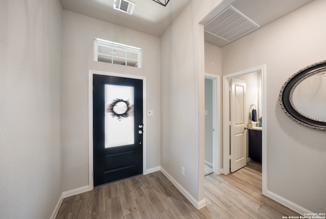 entryway with light hardwood / wood-style flooring