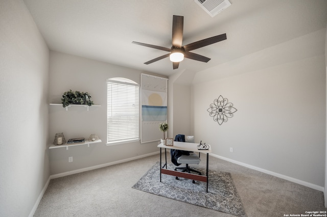 carpeted office space featuring ceiling fan