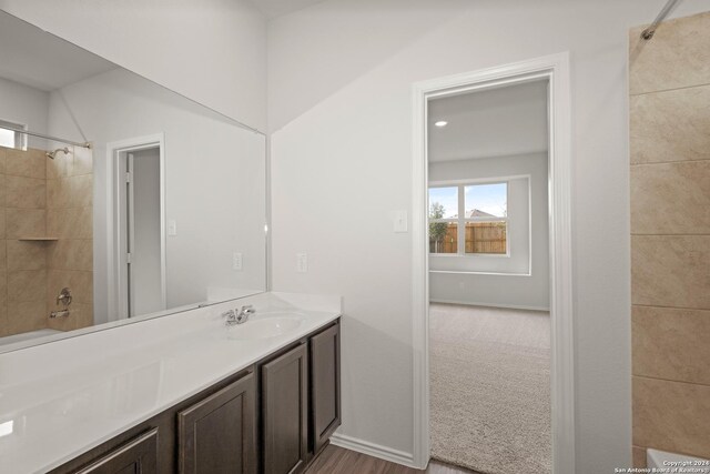 bathroom with toilet and hardwood / wood-style flooring