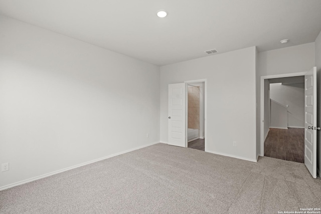 unfurnished bedroom with visible vents, recessed lighting, baseboards, and carpet floors