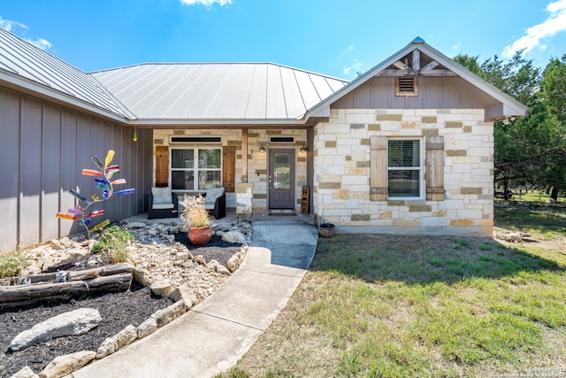 view of front of property with a front yard and a porch