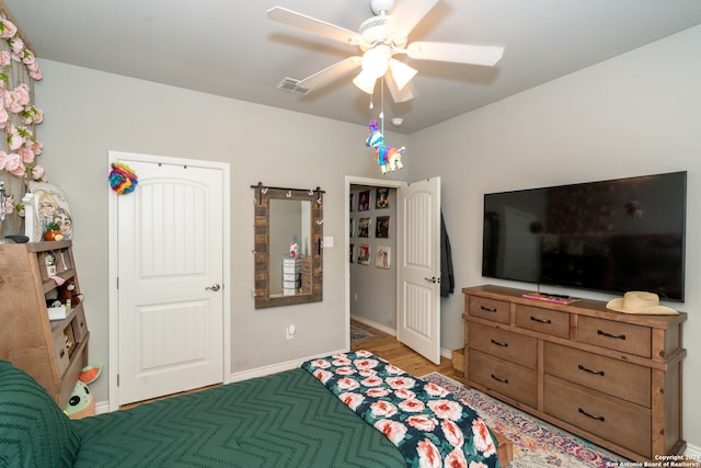 bedroom featuring ceiling fan and light wood-type flooring