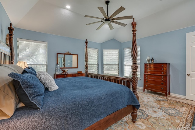 bedroom featuring baseboards, lofted ceiling, ceiling fan, and wood finished floors