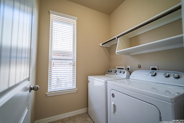 laundry room with washer and clothes dryer, laundry area, and baseboards