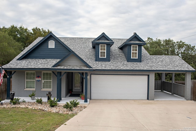 view of front of house featuring covered porch and a garage