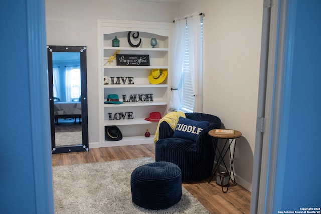 living area with wood-type flooring