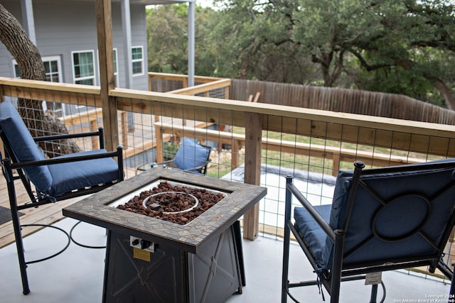 balcony with an outdoor fire pit