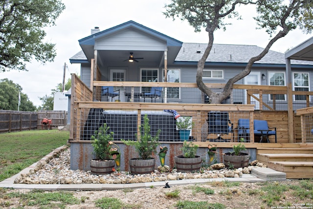 back of house featuring a yard, a deck, and ceiling fan