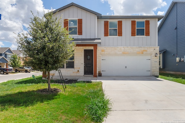 view of front of house featuring a garage and a front lawn