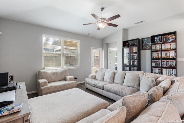 living room with a wealth of natural light, ceiling fan, wood-type flooring, and lofted ceiling