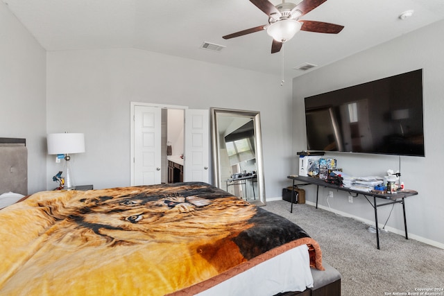 bedroom featuring lofted ceiling, ceiling fan, light carpet, and ensuite bath