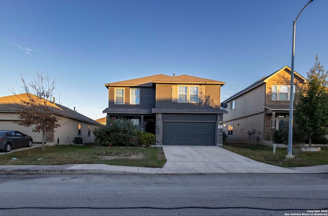 8446 Buckhorn Parke, San Antonio, TX 78254 - view of front of home featuring a garage, concrete driveway, and central AC unit