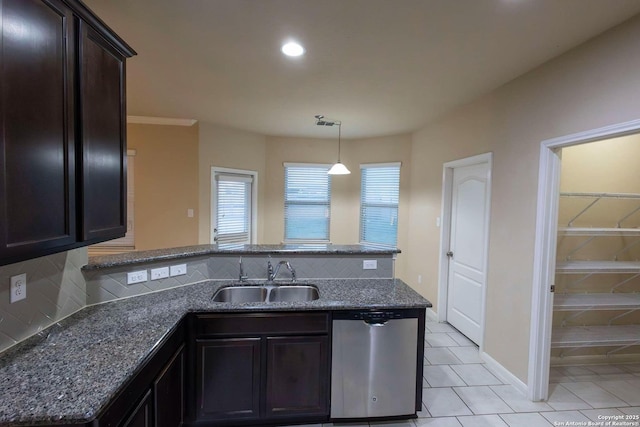 8446 Buckhorn Parke, San Antonio, TX 78254 - kitchen featuring a peninsula, dark stone countertops, stainless steel dishwasher, a sink, and backsplash