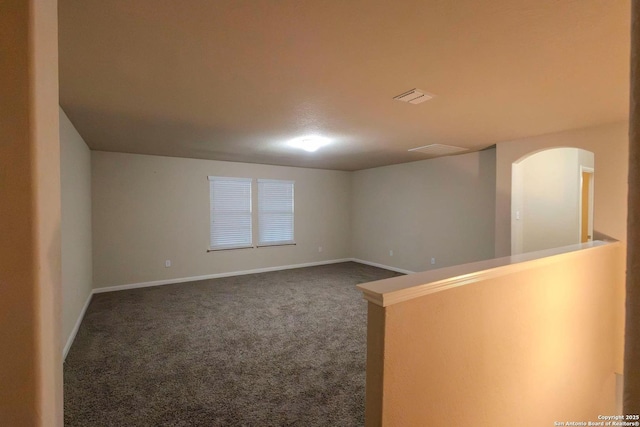 8446 Buckhorn Parke, San Antonio, TX 78254 - carpeted empty room with arched walkways, baseboards, and visible vents