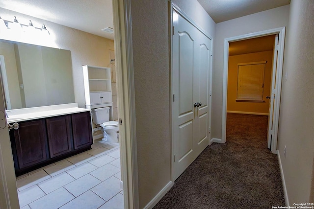 8446 Buckhorn Parke, San Antonio, TX 78254 - hall with light colored carpet, baseboards, and light tile patterned floors