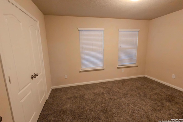 8446 Buckhorn Parke, San Antonio, TX 78254 - carpeted empty room featuring baseboards and a textured ceiling