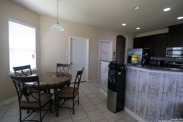 dining area featuring light tile patterned flooring