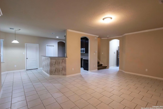 8446 Buckhorn Parke, San Antonio, TX 78254 - spare room with arched walkways, crown molding, and baseboards